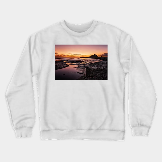 Bamburgh Sunrise Crewneck Sweatshirt by Reg-K-Atkinson